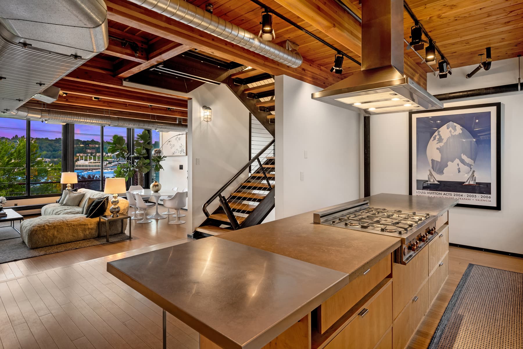 Chef's kitchen with warm wood beams
